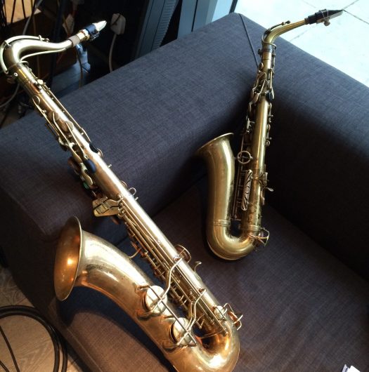 Two saxes on chair